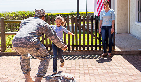 Soldier returns home to woman and child